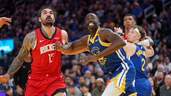 Apr 6, 2025; San Francisco, California, USA; Golden State Warriors forward Draymond Green (23) battles for position with Houston Rockets center Steven Adams (12) in the fourth quarter at the Chase Center. Mandatory Credit: Cary Edmondson-Imagn Images