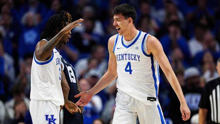Oct 30, 2025; Lexington, KY, USA; Kentucky Wildcats forward Andrija Jelavic (4) celebrates with guard Kam Williams (3) after making a basket during the first half against the Georgetown Hoyas at Rupp Arena at Central Bank Center. Mandatory Credit: Jordan Prather-Imagn Images