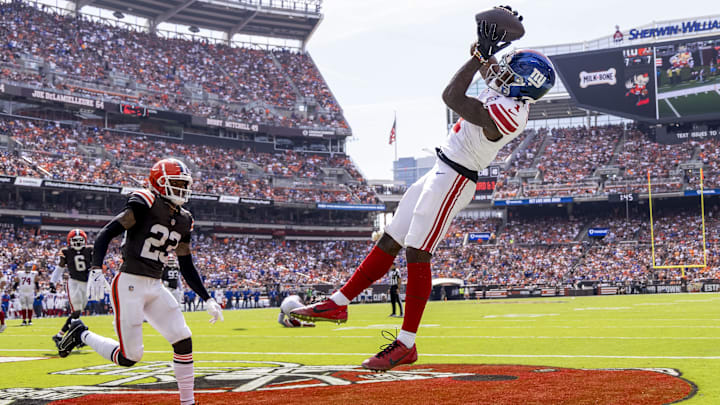 Sep 22, 2024; Cleveland, Ohio, USA; New York Giants wide receiver Malik Nabers (1) makes a touchdown reception under coverage by Cleveland Browns cornerback Martin Emerson Jr. (23) during the second quarter at Huntington Bank Field. Mandatory Credit: Scott Galvin-Imagn Images