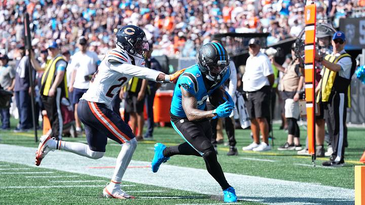 Carolina Panthers wide receiver Tetairoa McMillan (4) runs with the ball while defended by Chicago Bears cornerback Malik Muhammad II (24) in the fourth quarter against the at Bank of America Stadium. Mandatory Credit: Jim Dedmon-Imagn Images Carolina Panthers wide receiver Tetairoa McMillan (4) runs with the ball while defended by Chicago Bears cornerback Malik Muhammad II (24) in the fourth quarter against the at Bank of America Stadium. Mandatory Credit: Jim Dedmon-Imagn Images