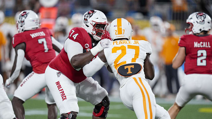 North Carolina State Wolfpack offensive tackle Anthony Belton (74) blocks Tennessee Volunteers defensive lineman James Pearce Jr. 