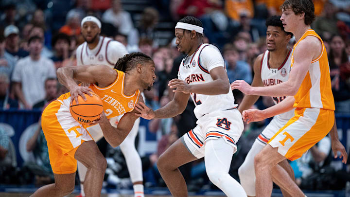 Tennessee guard Chaz Lanier (2) is guarded by Auburn guard Joah Shay (12) during the first half of their semifinal game of the SEC Men's Basketball Tournament at Bridgestone Arena in Nashville, Tenn., Saturday, March 15, 2025.