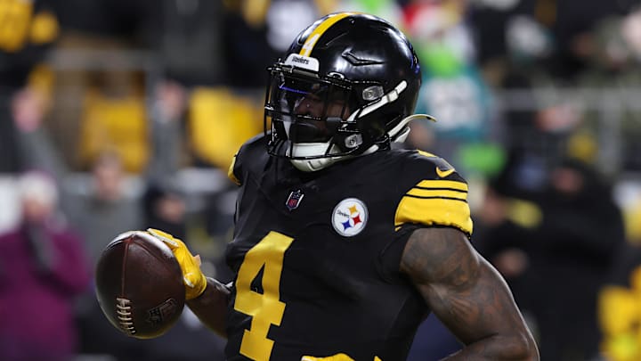 Dec 15, 2025; Pittsburgh, Pennsylvania, USA; Pittsburgh Steelers wide receiver DK Metcalf (4) scores a touchdown in the third quarter against the Miami Dolphins at Acrisure Stadium. Mandatory Credit: Charles LeClaire-Imagn Images