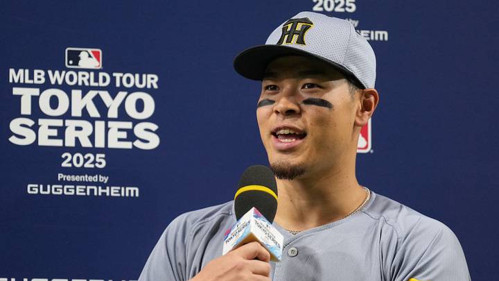 Mar 16, 2025; Bunkyo, Tokyo, Japan; Hanshin Tigers third baseman Teruaki Sato (8) is interviewed after defeating the Los Angeles Dodgers at Tokyo Dome. Mandatory Credit: Darren Yamashita-Imagn Images
