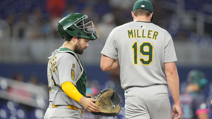 May 3, 2025; Miami, Florida, USA; Oakland Athletics pitcher Mason Miller (19) gets a visit from catcher Shea Langeliers (23) in the ninth inning against the Miami Marlins at loanDepot Park. Mandatory Credit: Jim Rassol-Imagn Images May 3, 2025; Miami, Florida, USA; Oakland Athletics pitcher Mason Miller (19) gets a visit from catcher Shea Langeliers (23) in the ninth inning against the Miami Marlins at loanDepot Park. Mandatory Credit: Jim Rassol-Imagn Images