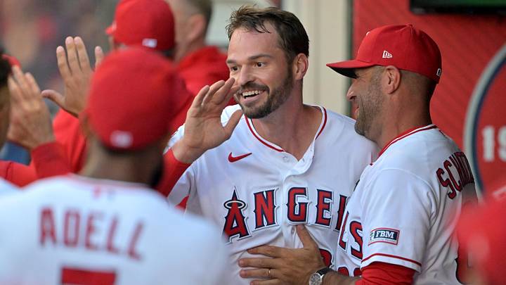 Angels left fielder Trey Mancini (34) is greeted in the dugout after scoring a run in the second inning against the Houston Astros at Angel Stadium on June 8, 2026. Angels left fielder Trey Mancini (34) is greeted in the dugout after scoring a run in the second inning against the Houston Astros at Angel Stadium on June 8, 2026.