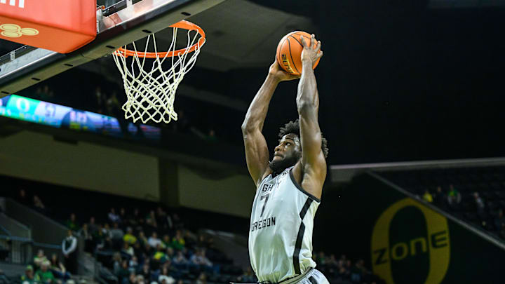 Dec 15, 2024; Eugene, Oregon, USA; Oregon Ducks forward Supreme Cook (7) dunks the ball during the second half against the Stephen F. Austin Lumberjacks at Matthew Knight Arena.