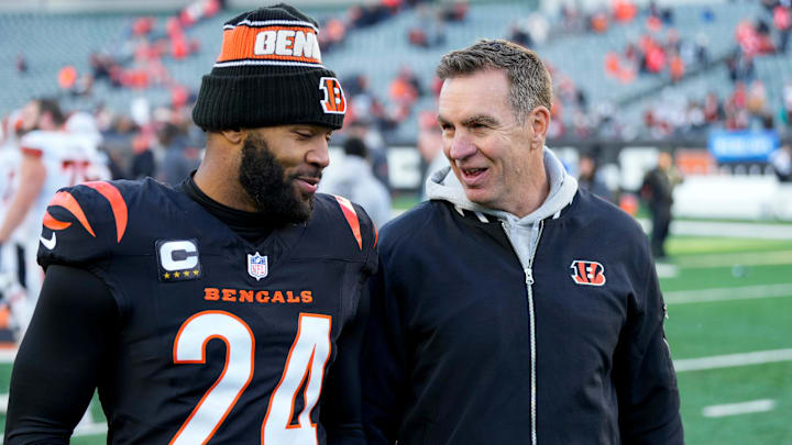 Cincinnati Bengals defensive coordinator Lou Anarumo smiles as he walks for the locker room with safety Vonn Bell (24) after the fourth quarter of the NFL Week 16 game between the Cincinnati Bengals and the Cleveland Browns at Paycor Stadium in downtown Cincinnati on Sunday, Dec. 22, 2024. The Bengals won 24-16.