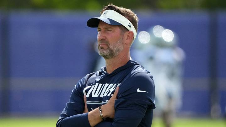 Dallas Cowboys head coach Brian Schottenheimer reacts during a joint practice against the Los Angeles Rams at the Rams Practice Facility. Dallas Cowboys head coach Brian Schottenheimer reacts during a joint practice against the Los Angeles Rams at the Rams Practice Facility.