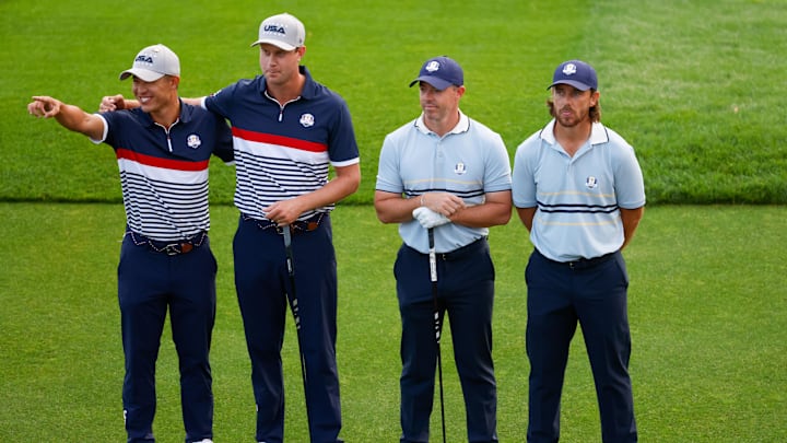  Team USA's Collin Morikawa and Harris English pose with Team Europe's Rory McIlroy Tommy Fleetwood on the first tee.