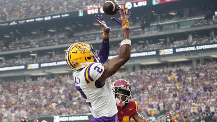Sep 1, 2024; Paradise, Nevada, USA; LSU Tigers wide receiver Kyren Lacy (2) attempts to catch the ball against Southern California Trojans cornerback Jacobe Covington (14) at Allegiant Stadium. Mandatory Credit: Kirby Lee-Imagn Images Sep 1, 2024; Paradise, Nevada, USA; LSU Tigers wide receiver Kyren Lacy (2) attempts to catch the ball against Southern California Trojans cornerback Jacobe Covington (14) at Allegiant Stadium. Mandatory Credit: Kirby Lee-Imagn Images