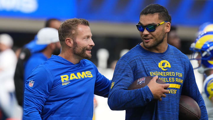 Aug 16, 2025; Inglewood, California, USA; Los Angeles Rams coach Sean McVay (left) talks with wide receiver Puka Nacua (12) against the Los Angeles Chargers in the first half at SoFi Stadium. Mandatory Credit: Kirby Lee-Imagn Images