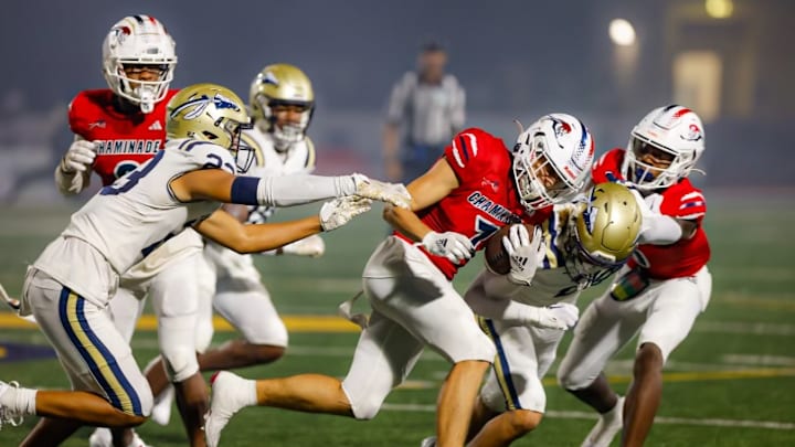 Chaminade Madonna wide receiver Jansen Lopez running against St. John Bosco’s defense 