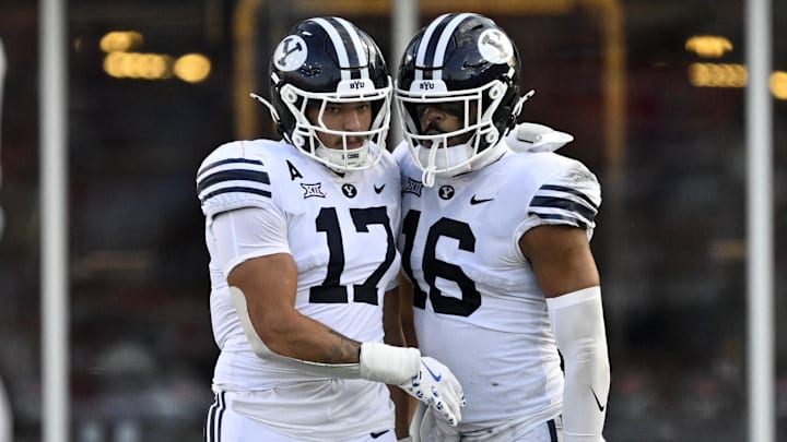Sep 6, 2024; Dallas, Texas, USA; Brigham Young Cougars linebacker Jack Kelly (17) and linebacker Isaiah Glasker (16) in action during the game between the Southern Methodist Mustangs and the Brigham Young Cougars at Gerald J. Ford Stadium. Mandatory Credit: Jerome Miron-Imagn Images