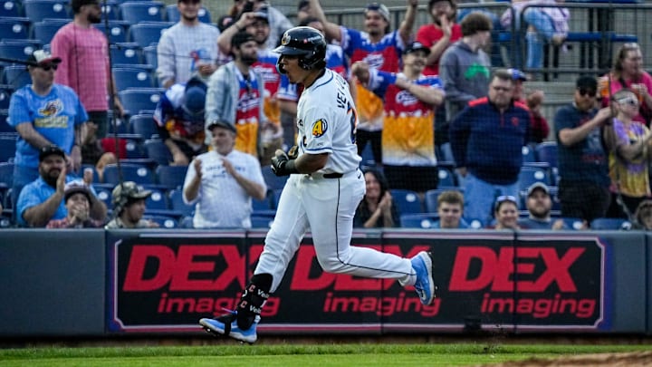 Akron infielder Ralphy Velazquez (24) reacts after hitting a solo home run during the home opening day game against Reading, April 2, 2026, in Akron, Ohio. Akron infielder Ralphy Velazquez (24) reacts after hitting a solo home run during the home opening day game against Reading, April 2, 2026, in Akron, Ohio.