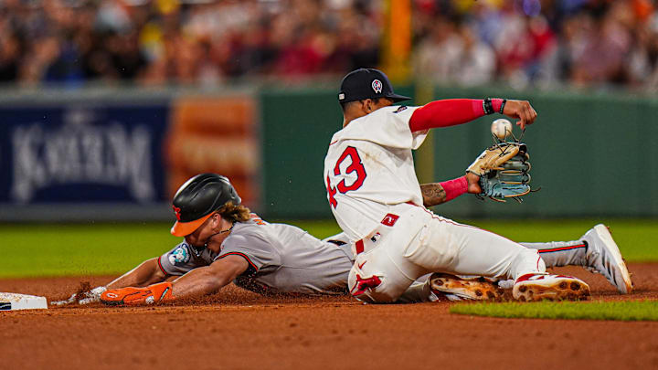 Baltimore Orioles second baseman Jackson Holliday (7) steals second base against Boston Red Sox second baseman Ceddanne Rafaela (43) in the seventh inning at Fenway Park in 2024.