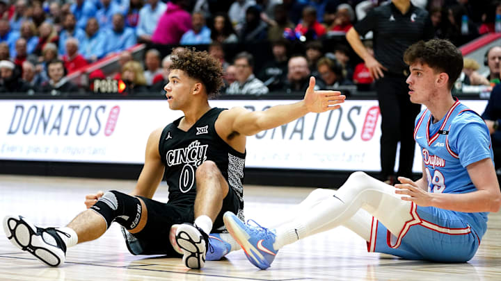 Cincinnati Bearcats guard Dan Skillings Jr. (0) reacts after a foul is called on him in the second half of a NCAA men’s basketball game between the Cincinnati Bearcats and Dayton Flyers, Friday, Dec. 20, 2024, at Heritage Bank Center in downtown Cincinnati. Bearcats won 66-59. Cincinnati Bearcats guard Dan Skillings Jr. (0) reacts after a foul is called on him in the second half of a NCAA men’s basketball game between the Cincinnati Bearcats and Dayton Flyers, Friday, Dec. 20, 2024, at Heritage Bank Center in downtown Cincinnati. Bearcats won 66-59.