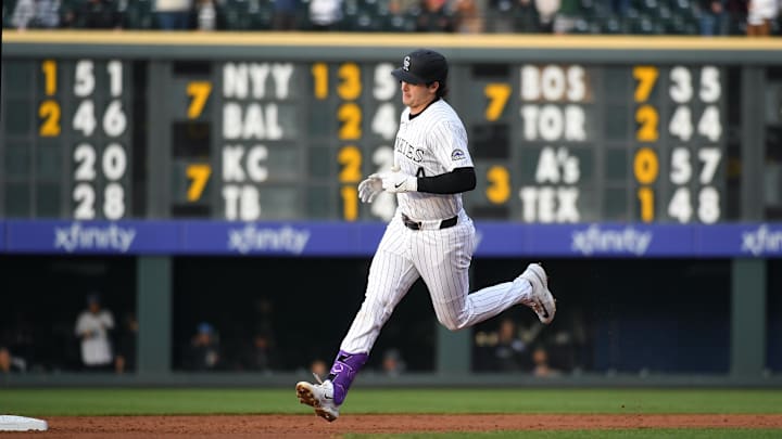 Apr 29, 2025; Denver, Colorado, USA; Colorado Rockies first base Michael Toglia (4) runs the bases after a solo home run during the second inning at Coors Field. Mandatory Credit: Christopher Hanewinckel-Imagn Images