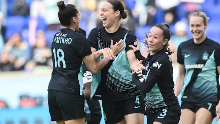 Gotham FC defender Lilly Reale (4) celebrates with teammates after scoring a goal against the North Carolina Courage