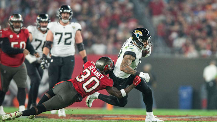 Dec 24, 2023; Tampa, Florida, USA; Tampa Bay Buccaneers defensive back Dee Delaney (30) tackles