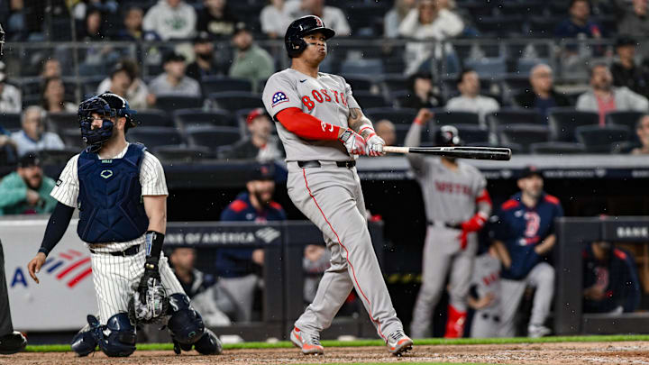 Jun 8, 2025; Bronx, New York, USA; Boston Red Sox designated hitter Rafael Devers (11) reacts after hitting a solo home run against the New York Yankees during the ninth inning at Yankee Stadium. Mandatory Credit: John Jones-Imagn Images