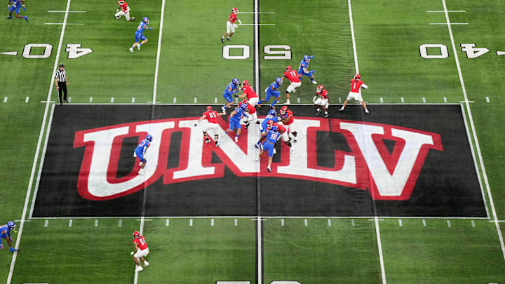 A general overall view as UNLV Rebels quarterback Jayden Maiava (1) throws the ball on the UNLV logo at midfield against the Boise State Broncos in the first half during the Mountain West Championship at Allegiant Stadium. Mandatory Credit: Kirby Lee-Imagn Images A general overall view as UNLV Rebels quarterback Jayden Maiava (1) throws the ball on the UNLV logo at midfield against the Boise State Broncos in the first half during the Mountain West Championship at Allegiant Stadium. Mandatory Credit: Kirby Lee-Imagn Images