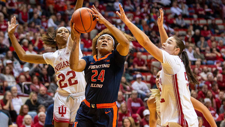 Illinois' Adalia McKenzie (24) gets past Indiana's Chloe Moore-McNeil (22) and Lilly Meister to score during the Indiana versus Illinois women's basketball game at Simon Skjodt Assembly Hall on Thursday, Jan. 16, 2025. Illinois' Adalia McKenzie (24) gets past Indiana's Chloe Moore-McNeil (22) and Lilly Meister to score during the Indiana versus Illinois women's basketball game at Simon Skjodt Assembly Hall on Thursday, Jan. 16, 2025.