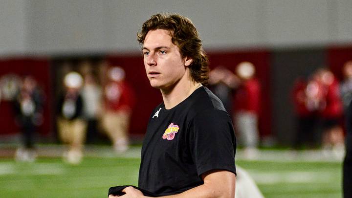 Oklahoma quarterback John Mateer helps out at the Sooners' Pro Day.