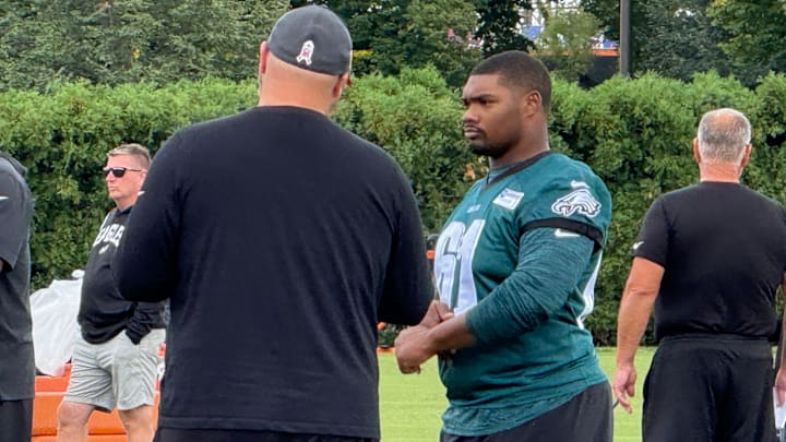 New Eagles offensive lineman Willie Lampkin, who was added to the 53-man roster on Wednesday, chats with Joe Duuglas during Thursday's practice. New Eagles offensive lineman Willie Lampkin, who was added to the 53-man roster on Wednesday, chats with Joe Duuglas during Thursday's practice.