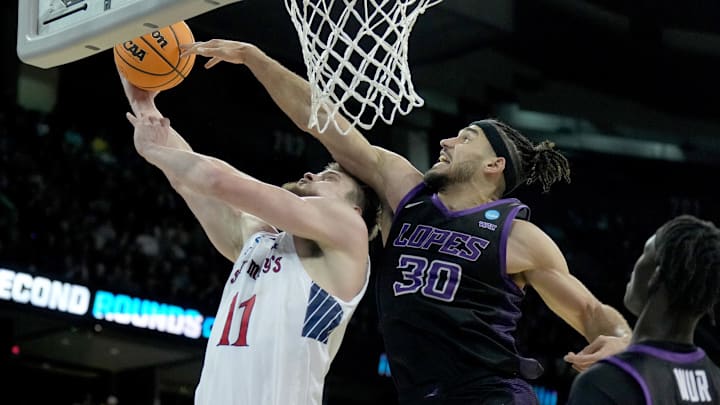 Mar 22, 2024; Spokane, WA, USA; Grand Canyon Antelopes forward Gabe McGlothan (30) blocks St. Mary's