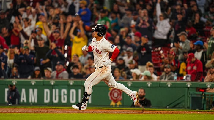 Boston Red Sox right fielder Rob Refsnyder (30) hits a home run against the Baltimore Orioles in the eighth inning at Fenway Park on Sept 9.