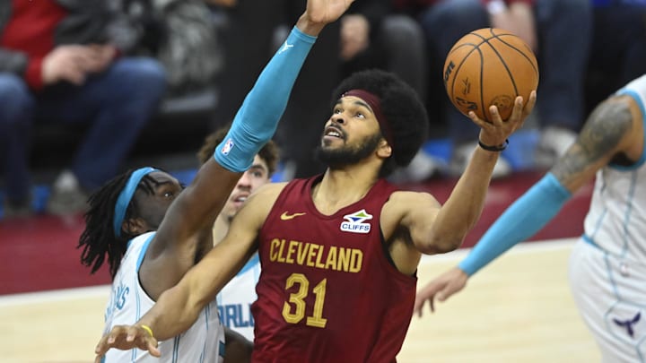 Jan 5, 2025; Cleveland, Ohio, USA; Cleveland Cavaliers center Jarrett Allen (31) shoots beside Charlotte Hornets center Mark Williams (5) in the fourth quarter at Rocket Mortgage FieldHouse. Mandatory Credit: David Richard-Imagn Images