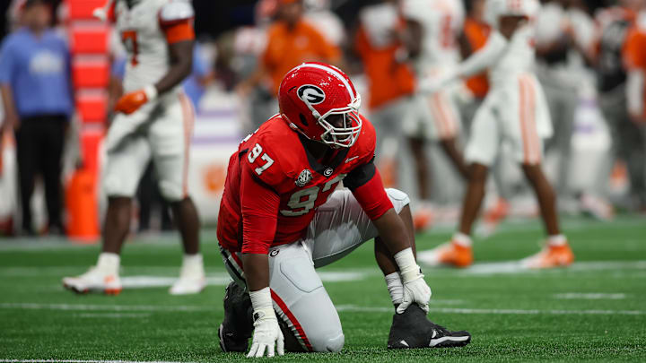 Aug 31, 2024; Atlanta, Georgia, USA; Georgia Bulldogs defensive lineman Warren Brinson (97) goes down with an injury against the Clemson Tigers in the first quarter at Mercedes-Benz Stadium. Mandatory Credit: Brett Davis-Imagn Images

