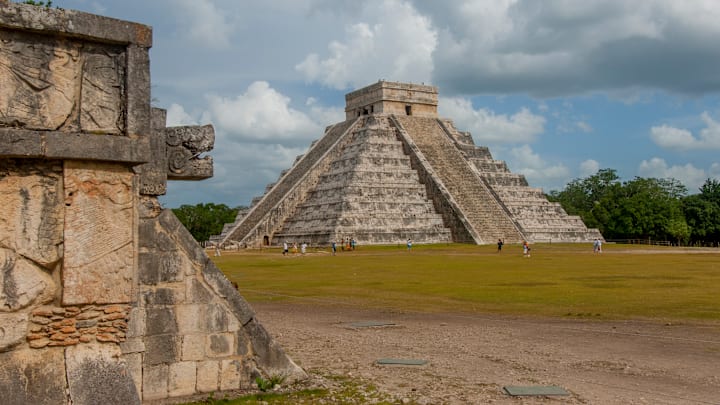 Tourists in front of the Maya's Temple of Kukulcan in Yucatán, Mexico.