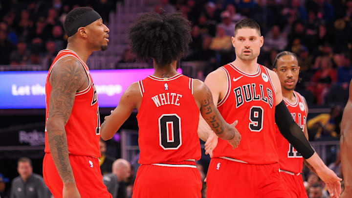 Mar 7, 2024; San Francisco, California, USA; Chicago Bulls guard Coby White (0) celebrate with teammates as a timeout is called against the Golden State Warriors during the third quarter at Chase Center. Mandatory Credit: Kelley L Cox-Imagn Images