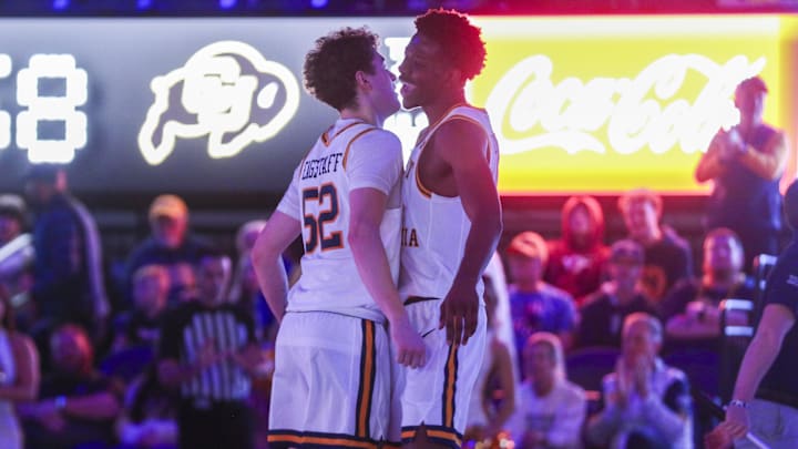 Jan 17, 2026; Morgantown, West Virginia, USA; West Virginia Mountaineers guard Treysen Eaglestaff (52) celebrates with West Virginia Mountaineers forward Brenen Lorient (0) during the second half against the Colorado Buffaloes at Hope Coliseum. Mandatory Credit: Ben Queen-Imagn Images