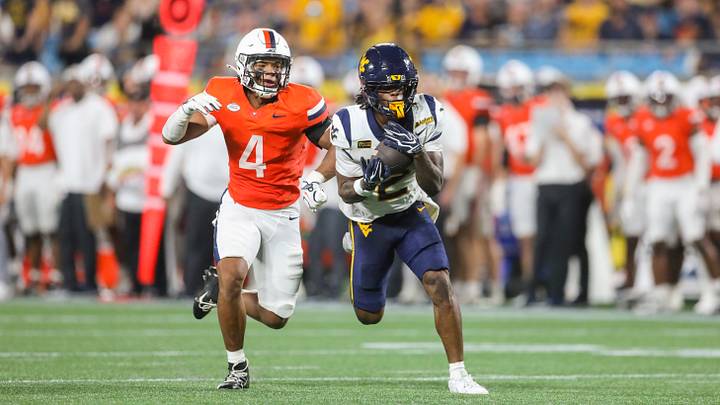 Sep 19, 2026; Charlotte, North Carolina, USA; West Virginia Mountaineers wide receiver DJ Epps (2) catches a pass while defended by Virginia Cavaliers safety Corey Costner (4) during the second quarter at Bank of America Stadium. Mandatory Credit: Ben Queen-Imagn Images Sep 19, 2026; Charlotte, North Carolina, USA; West Virginia Mountaineers wide receiver DJ Epps (2) catches a pass while defended by Virginia Cavaliers safety Corey Costner (4) during the second quarter at Bank of America Stadium. Mandatory Credit: Ben Queen-Imagn Images