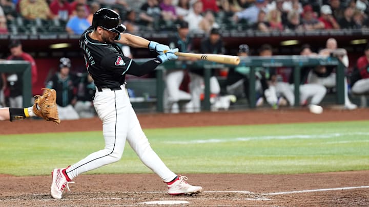 Jun 30, 2024; Phoenix, Arizona, USA; Arizona Diamondbacks pinch hitter Blaze Alexander (9) hits a two RBI single against the Oakland Athletics during the seventh inning at Chase Field. Mandatory Credit: Joe Camporeale-Imagn Images Jun 30, 2024; Phoenix, Arizona, USA; Arizona Diamondbacks pinch hitter Blaze Alexander (9) hits a two RBI single against the Oakland Athletics during the seventh inning at Chase Field. Mandatory Credit: Joe Camporeale-Imagn Images