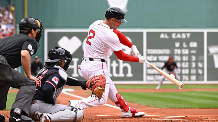 Sep 1, 2025; Boston, Massachusetts, USA; Boston Red Sox third baseman Alex Bregman (2) hits a double during the first inning against the Cleveland Guardians at Fenway Park. Mandatory Credit: Eric Canha-Imagn Images