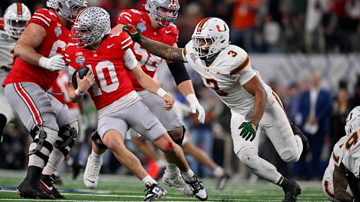 Miami defensive lineman Akheem Mesidor chases Ohio State quarterback Julian Sayin during the Cotton Bowl.