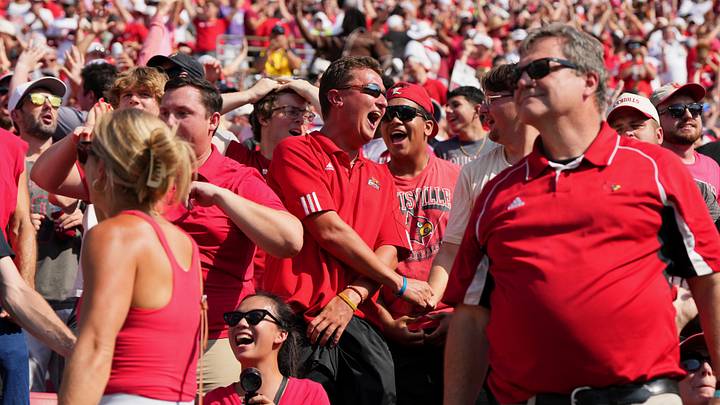 Sep 19, 2026; Louisville, Kentucky, USA; Louisville Cardinals fans celebrate a touchdown against the Southern Methodist Mustangs during the first quarter at L&N Federal Credit Union Stadium. Mandatory Credit: Chris Carter-Imagn Images Sep 19, 2026; Louisville, Kentucky, USA; Louisville Cardinals fans celebrate a touchdown against the Southern Methodist Mustangs during the first quarter at L&N Federal Credit Union Stadium. Mandatory Credit: Chris Carter-Imagn Images