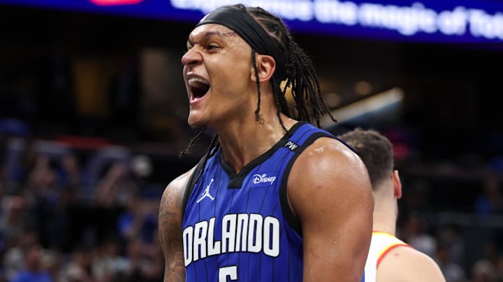 Apr 15, 2025; Orlando, Florida, USA;  Orlando Magic forward Paolo Banchero (5) reacts after a play against the Atlanta Hawks in the fourth quarter at Kia Center. Mandatory Credit: Nathan Ray Seebeck-Imagn Images