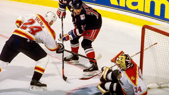 New York Rangers Mark Messier (11) in action against Florida Panthers Robert Svehla (24) and John Vanbiesbrouck (34) during the 1996-97 season at Miami Arena. Mandatory Credit: RVR Photos-USA TODAY Sports