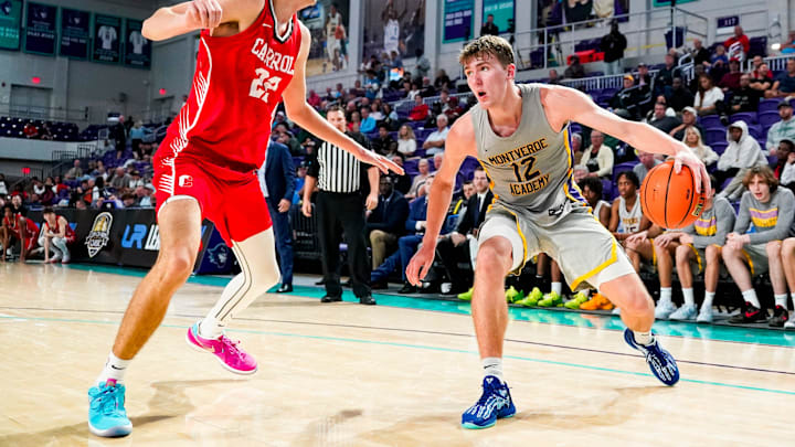 Montverde Academy Eagles forward Trent Sisley (12) handles the ball as Archbishop Carroll Patriots forward Drew Corrao (22) guards him during the third quarter of the first round of the 51st annual City of Palms Classic at Suncoast Credit Union Arena in Fort Myers, Fla., on Wednesday, Dec. 18, 2024. Montverde Academy Eagles forward Trent Sisley (12) handles the ball as Archbishop Carroll Patriots forward Drew Corrao (22) guards him during the third quarter of the first round of the 51st annual City of Palms Classic at Suncoast Credit Union Arena in Fort Myers, Fla., on Wednesday, Dec. 18, 2024.