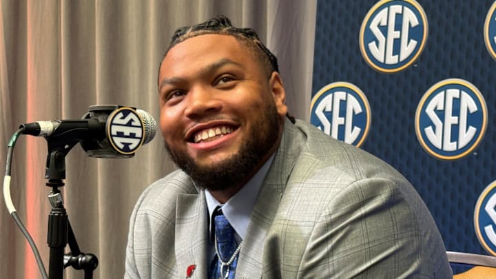 Arkansas Razorbacks defensive tackle Cam Ball speaks in the main media room of SEC Media Days at the College Football Hall of Fame Thursday in Atlanta, Georgia.