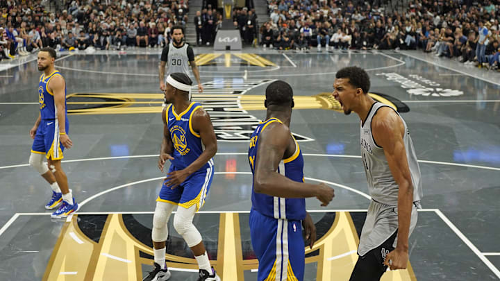 Nov 14, 2025; San Antonio, Texas, USA; San Antonio Spurs forward Victor Wembanyama (1) reacts after dunking over Golden State Warriors forward Draymond Green (23) during the second half at Frost Bank Center. Mandatory Credit: Scott Wachter-Imagn Images Nov 14, 2025; San Antonio, Texas, USA; San Antonio Spurs forward Victor Wembanyama (1) reacts after dunking over Golden State Warriors forward Draymond Green (23) during the second half at Frost Bank Center. Mandatory Credit: Scott Wachter-Imagn Images