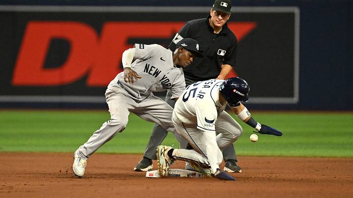 Oct 5, 2026; St. Petersburg, Florida, USA; Tampa Bay Rays outfielder Victor Mesa Jr. (25) steals New York Yankees second baseman Jazz Chisholm Jr. (13) base during the seventh inning in game two of the ALDS for the 2026 MLB Playoffs at Tropicana Field. Mandatory Credit: Jonathan Dyer-Imagn Images Oct 5, 2026; St. Petersburg, Florida, USA; Tampa Bay Rays outfielder Victor Mesa Jr. (25) steals New York Yankees second baseman Jazz Chisholm Jr. (13) base during the seventh inning in game two of the ALDS for the 2026 MLB Playoffs at Tropicana Field. Mandatory Credit: Jonathan Dyer-Imagn Images