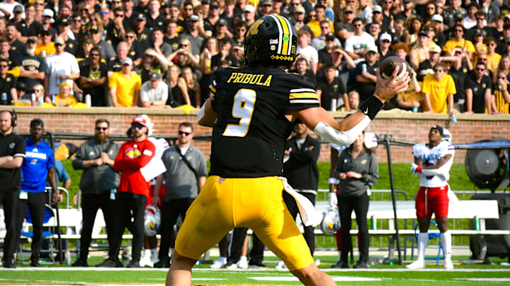 Sep 6, 2025; Columbia, Missouri, USA; Missouri Tigers quarterback Beau Pribula (9) throws a touchdown in the second half of the Border War against the Kansas Jayhawks at Faurot Field at Memorial Stadium.