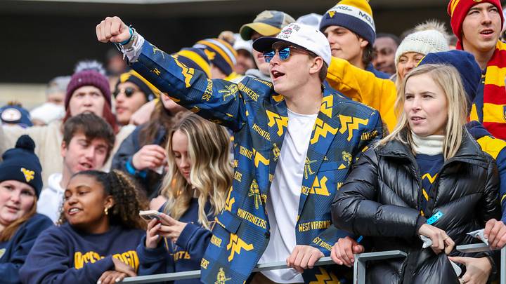 Nov 20, 2021; Morgantown, West Virginia, USA; West Virginia Mountaineers fans cheer during the second quarter against the Texas Longhorns at Mountaineer Field at Milan Puskar Stadium. Mandatory Credit: Ben Queen-USA TODAY Sports