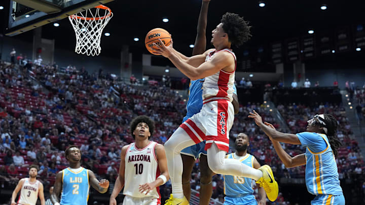 Mar 20, 2026; San Diego, CA, USA; Arizona Wildcats guard Brayden Burries (5) shoots against LIU Sharks forward Jamal Fuller (33) in the first half during a first round game of the men's 2026 NCAA Tournament at Viejas Arena. Mandatory Credit: Kirby Lee-Imagn Images Mar 20, 2026; San Diego, CA, USA; Arizona Wildcats guard Brayden Burries (5) shoots against LIU Sharks forward Jamal Fuller (33) in the first half during a first round game of the men's 2026 NCAA Tournament at Viejas Arena. Mandatory Credit: Kirby Lee-Imagn Images